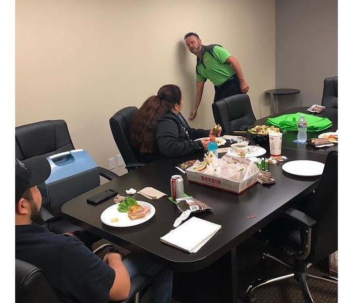 A man doing a lunch and learn with an insurance office.
