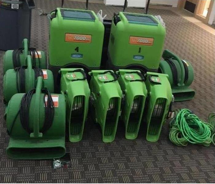 Green SERVPRO equipment in warehouse